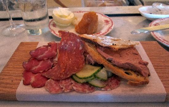Lucia signature dishes  House-Made Pastas (changes seasonally, e.g., Tagliatelle with Pork Ragu), Salumi Misti (house-cured meats), seasonal antipasti.